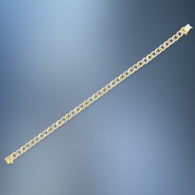 ONE 14KT WHITE AND YELLOW GOLD DIAMOND BRACELET CONTAINING .79 CTS OF NATURAL ROUND BRILLIANT CUT DIAMONDS
