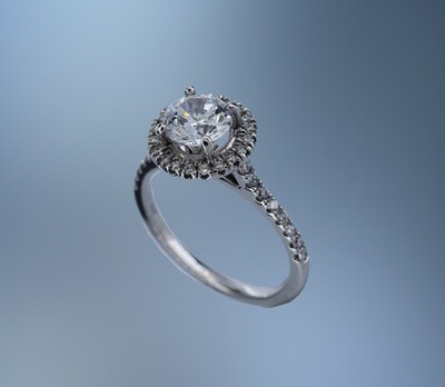 18KT WHITE GOLD HALO STYLE ENGAGEMENT RING FEATURING 38 ROUND BRILLIANT CUT DIAMONDS TOTALING 0.39 CTS