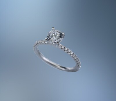 14 KT WHITE GOLD ENGAGEMENT RING FEATURING 20 ROUND BRILLIANT CUT DIAMONDS TOTALING 0.20 CTS.