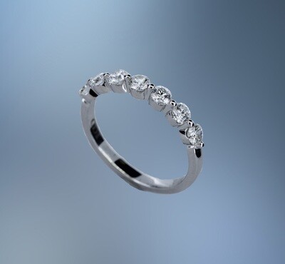 14KT WHITE GOLD DIAMOND WEDDING BAND FEATURING 7 ROUND BRILLIANT DIAMONDS TOTALING 0.74 CTS