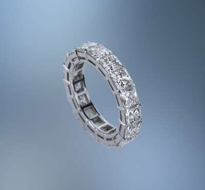 PLATINUM ETERNITY RING FEATURING 17 RADIANT CUT DIAMONDS TOTALING 6.82 CTS
