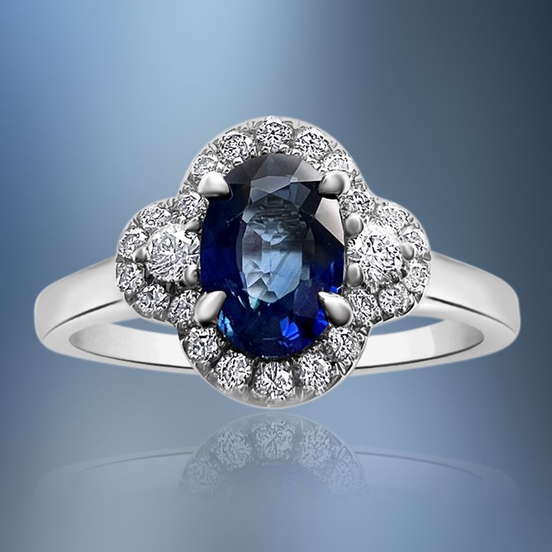 ONE 14KT WHITE GOLD LADIES DIAMOND AND SAPPHIRE RING