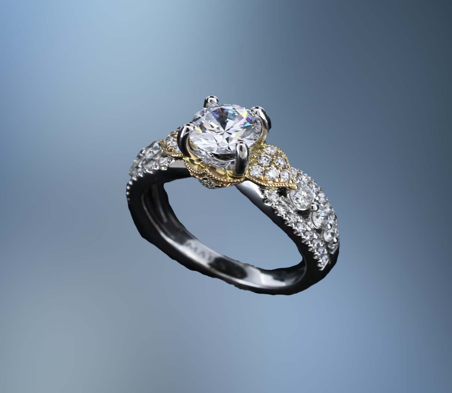 14KT TWO TONE ENGAGEMENT RING FEATURING  52 ROUND BRILLIANT CUT DIAMONDS TOTALING 0.70 CTS.