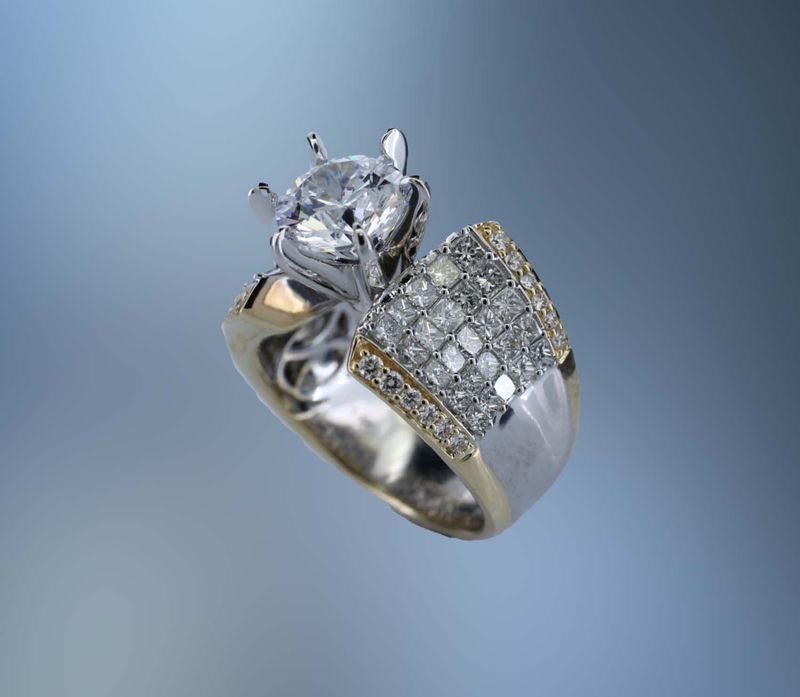 14 KT TWO TONE GOLD ENGAGEMENT RING FEATURING 74 ROUND BRILLIANT & PRINCESS CUT DIAMONDS TOTALING 2.01 CTS 14 KT TWO TONE GOLD ENGAGEMENT RING FEATURING 74 ROUND BRILLIANT & PRINCESS CUT DIAMONDS TOTALING 2.01 CTS