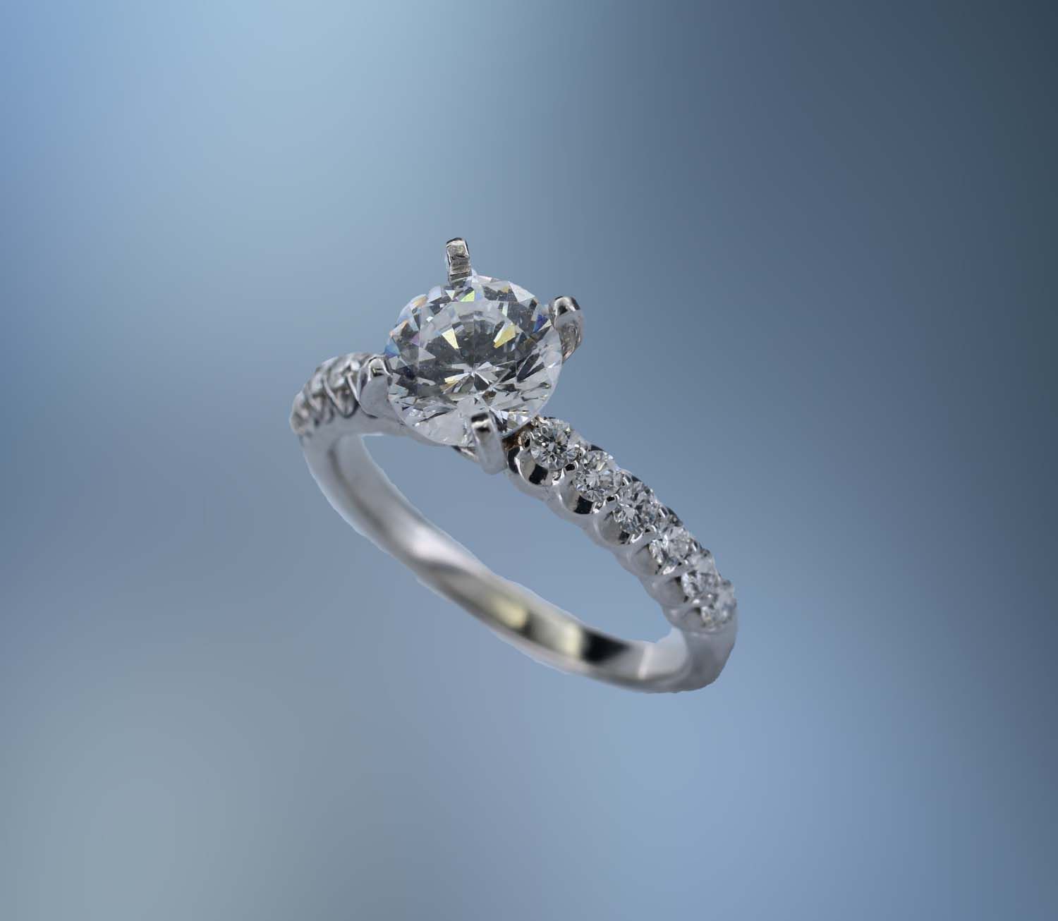 14KT WHITE GOLD ENGAGEMENT RING FEATURING 12 ROUND BRILLIANT CUT DIAMONDS TOTALING 0.39 CTS 14KT WHITE GOLD ENGAGEMENT RING FEATURING 12 ROUND BRILLIANT CUT DIAMONDS TOTALING 0.39 CTS