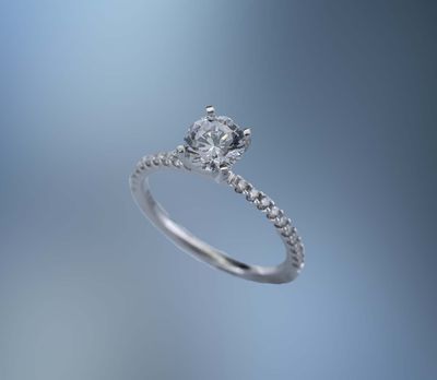 14 KT WHITE GOLD ENGAGEMENT RING FEATURING 20 ROUND BRILLIANT CUT DIAMONDS TOTALING 0.20 CTS.
