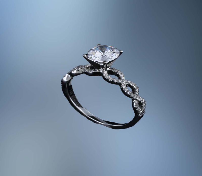 14KT WHITE GOLD ENGAGEMENT RING FEATURING 60 ROUND BRILLIANT CUT DIAMONDS TOTALING 0.18 CTS. 14KT WHITE GOLD ENGAGEMENT RING FEATURING 60 ROUND BRILLIANT CUT DIAMONDS TOTALING 0.18 CTS.