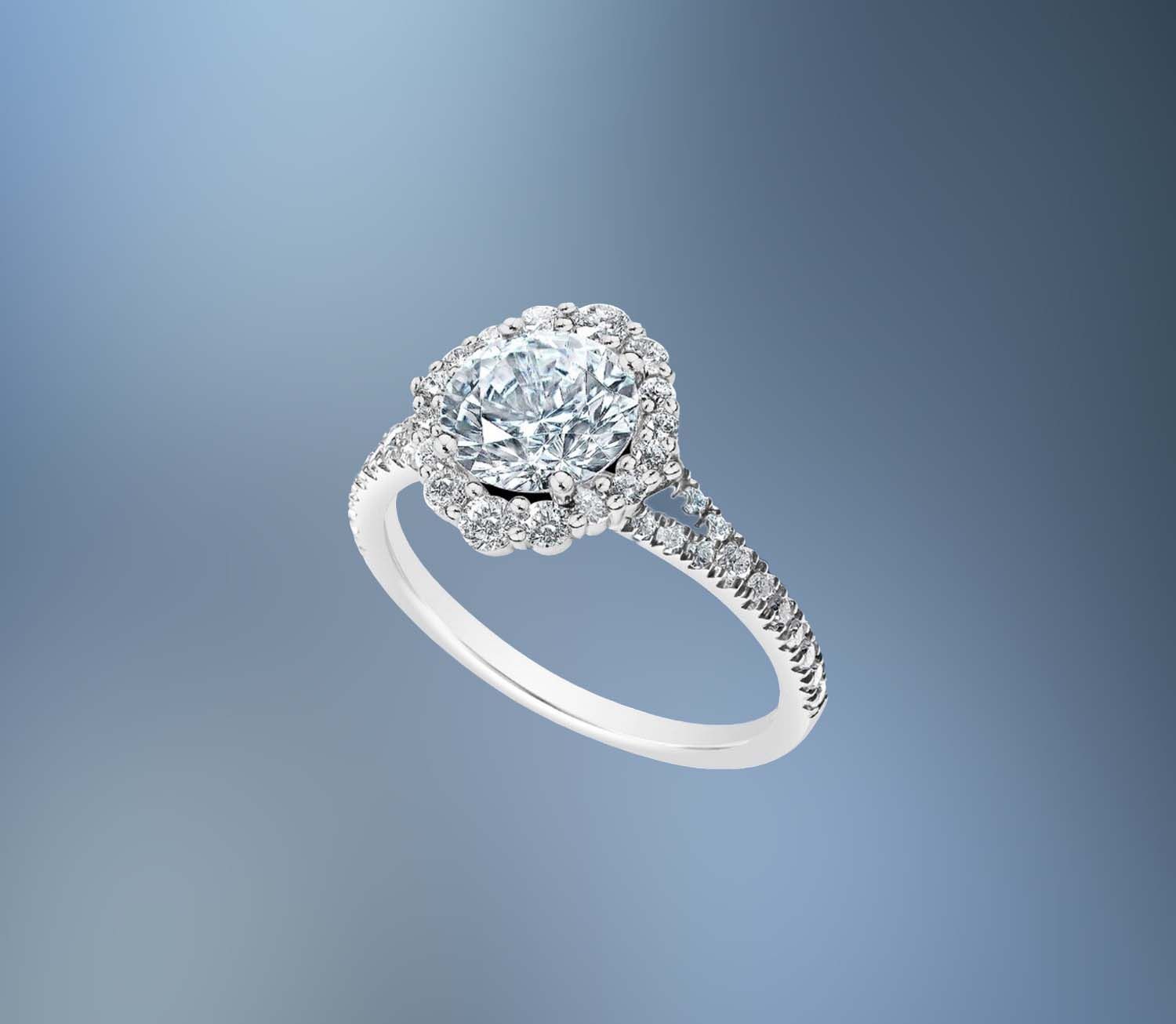 14KT WHITE GOLD HALO ENGAGEMENT RING FEATURING 42 ROUND BRILLIANT DIAMONDS TOTALING .54 CTS 14KT WHITE GOLD HALO ENGAGEMENT RING FEATURING 42 ROUND BRILLIANT DIAMONDS TOTALING .54 CTS