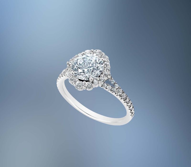 14KT WHITE GOLD HALO ENGAGEMENT RING FEATURING 42 ROUND BRILLIANT DIAMONDS TOTALING .54 CTS 14KT WHITE GOLD HALO ENGAGEMENT RING FEATURING 42 ROUND BRILLIANT DIAMONDS TOTALING .54 CTS