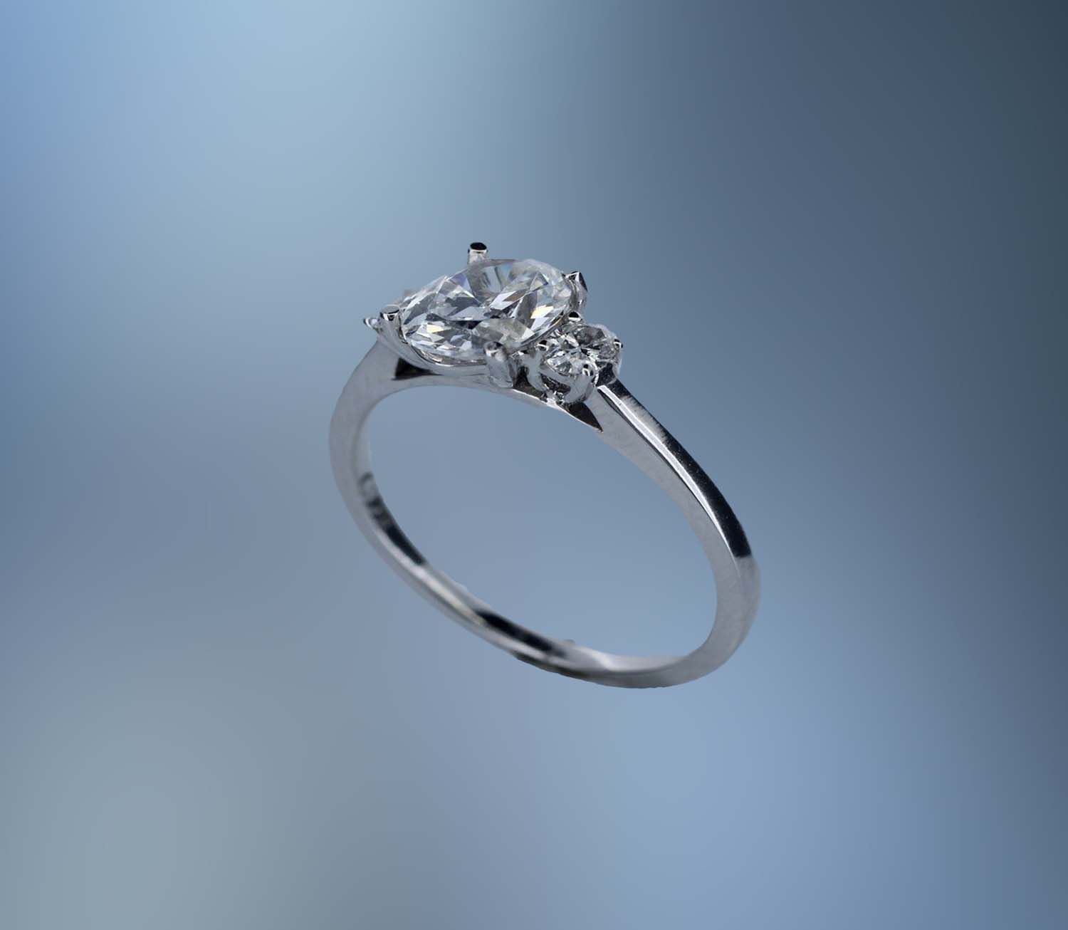 14KT WHITE GOLD ENGAGEMENT RING FEATURING  2 OVAL DIAMONDS TOTALING .18 CTS
