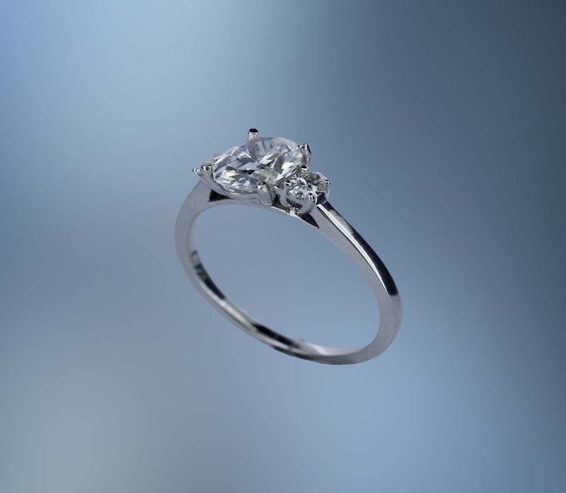 14KT WHITE GOLD ENGAGEMENT RING FEATURING 2 OVAL DIAMONDS TOTALING .18 CTS 14KT WHITE GOLD ENGAGEMENT RING FEATURING 2 OVAL DIAMONDS TOTALING .18 CTS