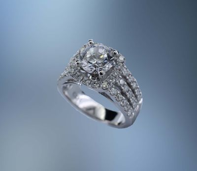 14 KT WHITE GOLD HALO STYLE ENGAGEMENT RING  FEATURING 46 ROUND BRILLIANT CUT DIAMONDS TOTALING 1.22 CTS.