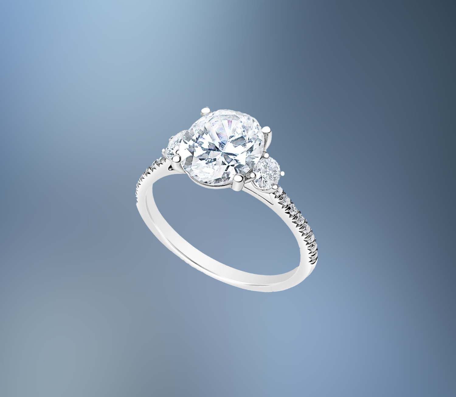 14KT WHITE GOLD OVAL ENGAGEMENT RING FEATURING TWO OVAL DIAMONDS & 16 ROUND BRILLIANT DIAMONDS TOTALING .42 CTS 14KT WHITE GOLD OVAL ENGAGEMENT RING FEATURING TWO OVAL DIAMONDS & 16 ROUND BRILLIANT DIAMONDS TOTALING .42 CTS