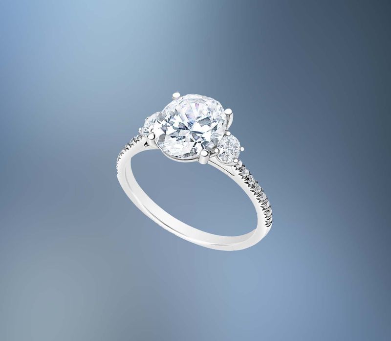 14KT WHITE GOLD OVAL ENGAGEMENT RING FEATURING TWO OVAL DIAMONDS & 16 ROUND BRILLIANT DIAMONDS TOTALING .42 CTS 14KT WHITE GOLD OVAL ENGAGEMENT RING FEATURING TWO OVAL DIAMONDS & 16 ROUND BRILLIANT DIAMONDS TOTALING .42 CTS