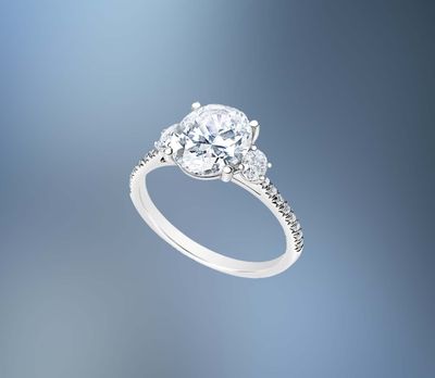 14KT WHITE GOLD OVAL ENGAGEMENT RING FEATURING TWO OVAL DIAMONDS & 16 ROUND BRILLIANT DIAMONDS TOTALING .42 CTS