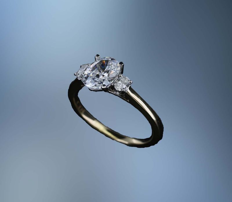 14KT YELLOW GOLD ENGAGEMENT RING FEATURING 2 OVAL DIAMONDS TOTALING .19 CTS 14KT YELLOW GOLD ENGAGEMENT RING FEATURING 2 OVAL DIAMONDS TOTALING .19 CTS