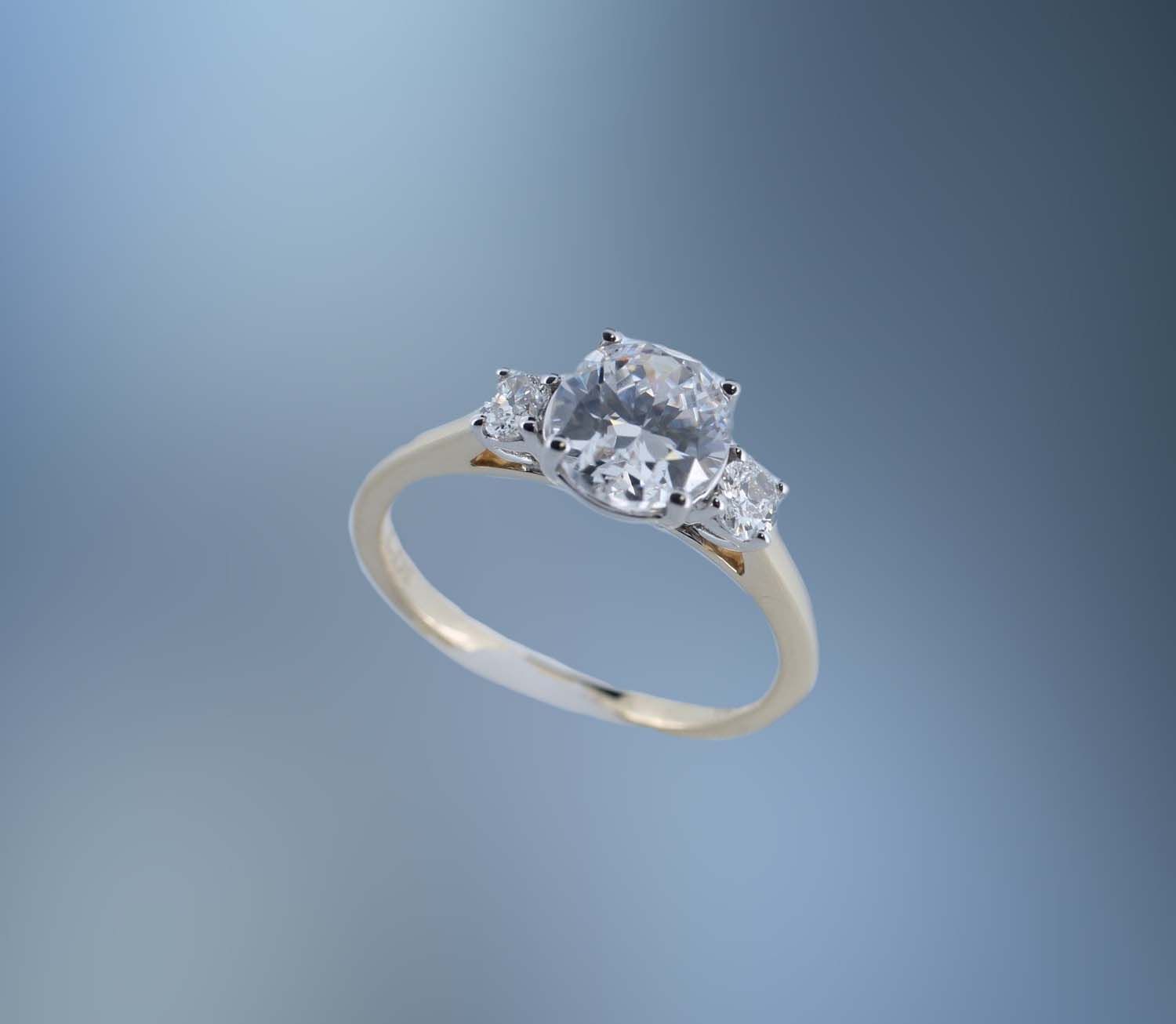 ONE 14KT YELLOW GOLD ENG RING CONTAINING TWO 4 X 3 MM NATURAL OVAL DIAMONDS TOTALING .29 CTS TW