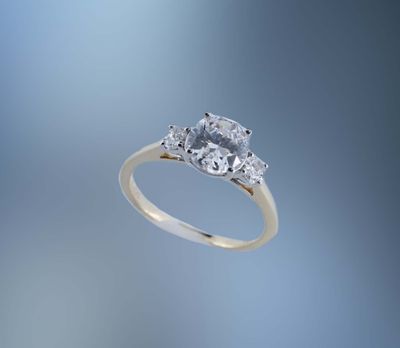 ONE 14KT YELLOW GOLD ENG RING CONTAINING TWO 4 X 3 MM NATURAL OVAL DIAMONDS TOTALING .29 CTS TW