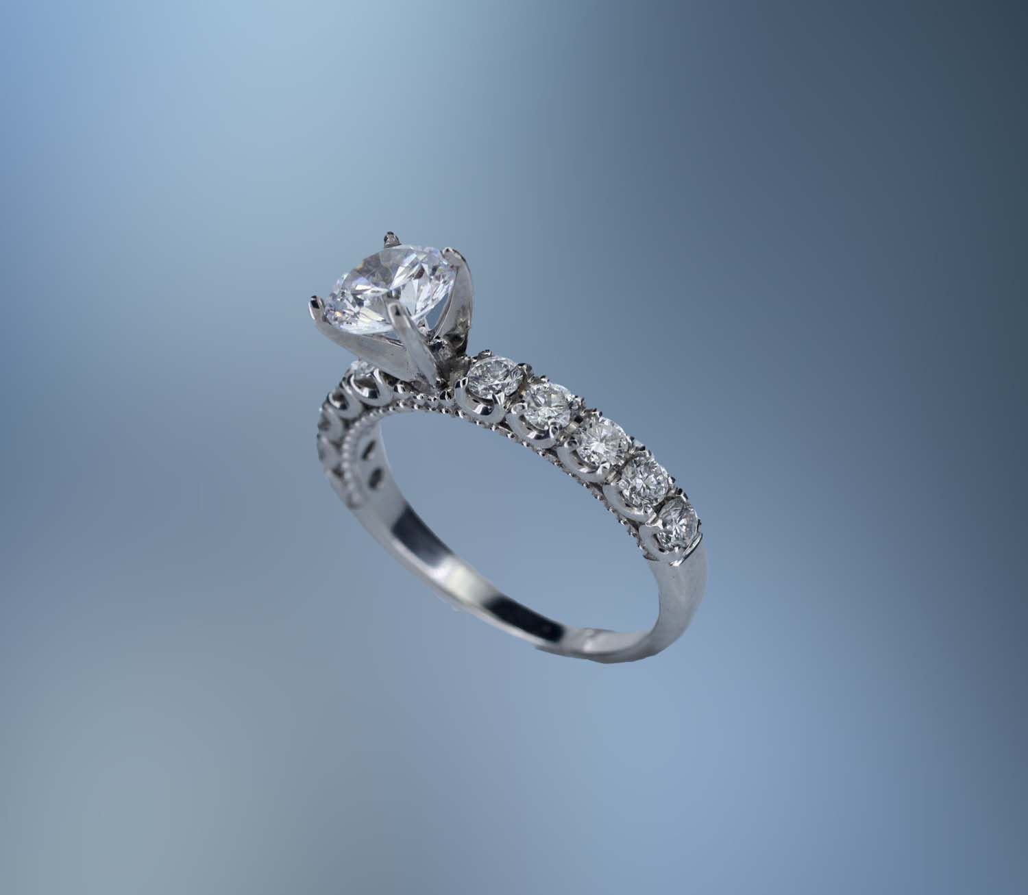 18KT WHITE GOLD ENGAGEMENT RING SETTING FEATURING 10 ROUND BRILLIANT CUT DIAMONDS TOTALING .60 CTS 18KT WHITE GOLD ENGAGEMENT RING SETTING FEATURING 10 ROUND BRILLIANT CUT DIAMONDS TOTALING .60 CTS