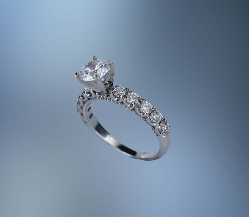 18KT WHITE GOLD ENGAGEMENT RING SETTING FEATURING 10 ROUND BRILLIANT CUT DIAMONDS TOTALING .60 CTS 18KT WHITE GOLD ENGAGEMENT RING SETTING FEATURING 10 ROUND BRILLIANT CUT DIAMONDS TOTALING .60 CTS