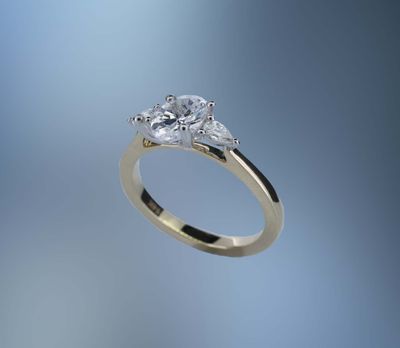 ONE 14KT YELLOW AND WHITE GOLD DIAMOND ENGAGEMENT RING CONTAINING TWO PEAR SHAPE DIAMONDS, TOTALING .20 CTS. ONE 14KT YELLOW AND WHITE GOLD DIAMOND ENGAGEMENT RING CONTAINING TWO PEAR SHAPE DIAMONDS, TOTALING .20 CTS.