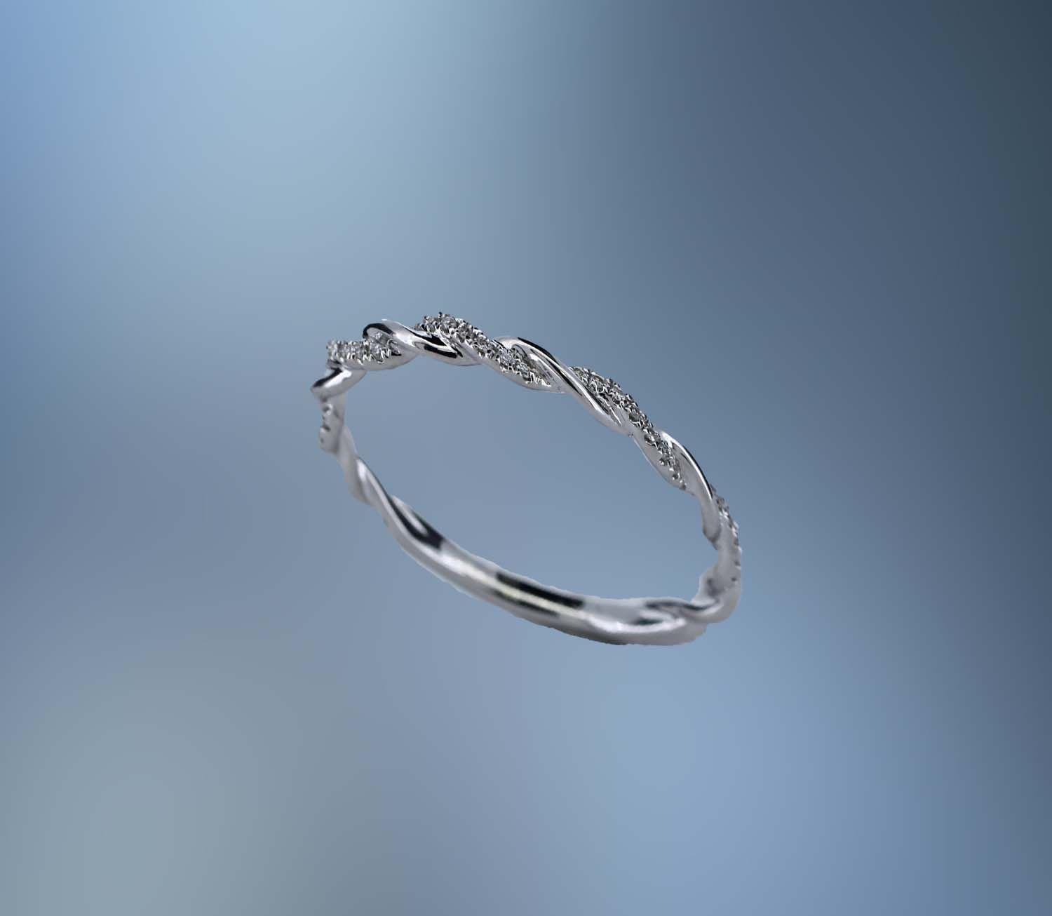 14 KT WHITE GOLD DIAMOND ANNIVERSARY BAND FEATURING  42 ROUND BRILLIANT CUT DIAMONDS TOTALING 0.10 CTS