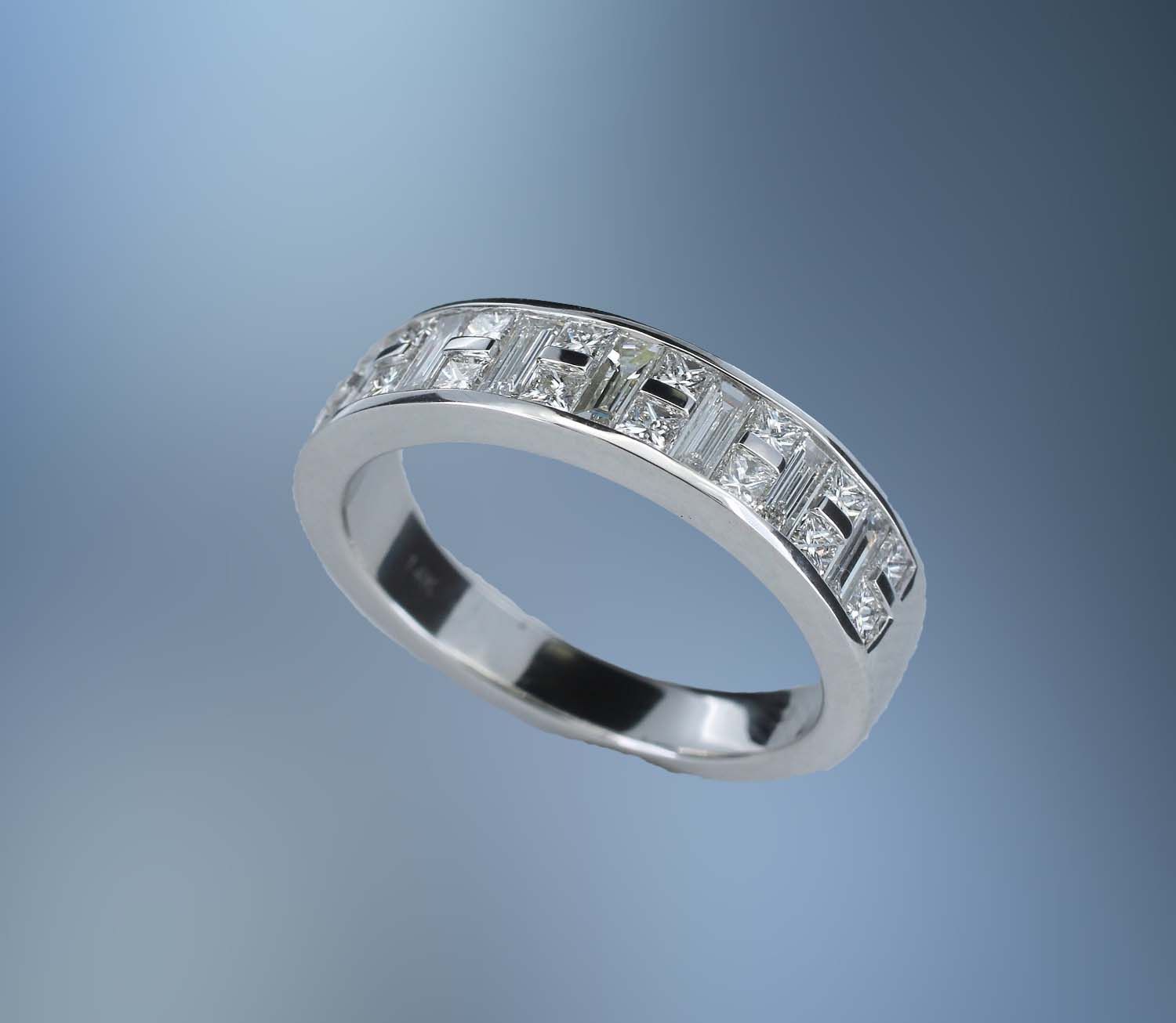14KT WHITE GOLD DIAMOND BAND FEATURING  16 PRINCESS CUT DIAMONDS TOTALING .49 CTS & 7 BAGUETTE DIAMONDS TOTALING .55 CTS