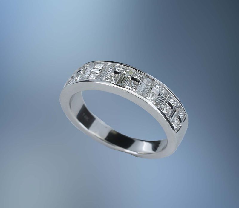 14KT WHITE GOLD DIAMOND BAND FEATURING  16 PRINCESS CUT DIAMONDS TOTALING .49 CTS & 7 BAGUETTE DIAMONDS TOTALING .55 CTS