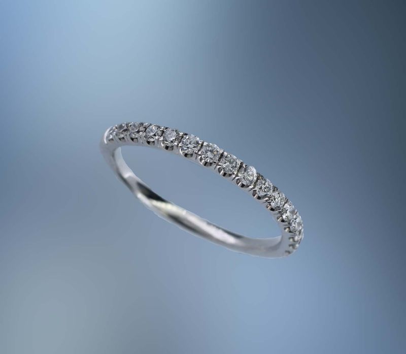 14KT WHITE GOLD DIAMOND WEDDING BAND FEATURING  16 ROUND BRILLIANT DIAMONDS TOTALING 0.35 CTS