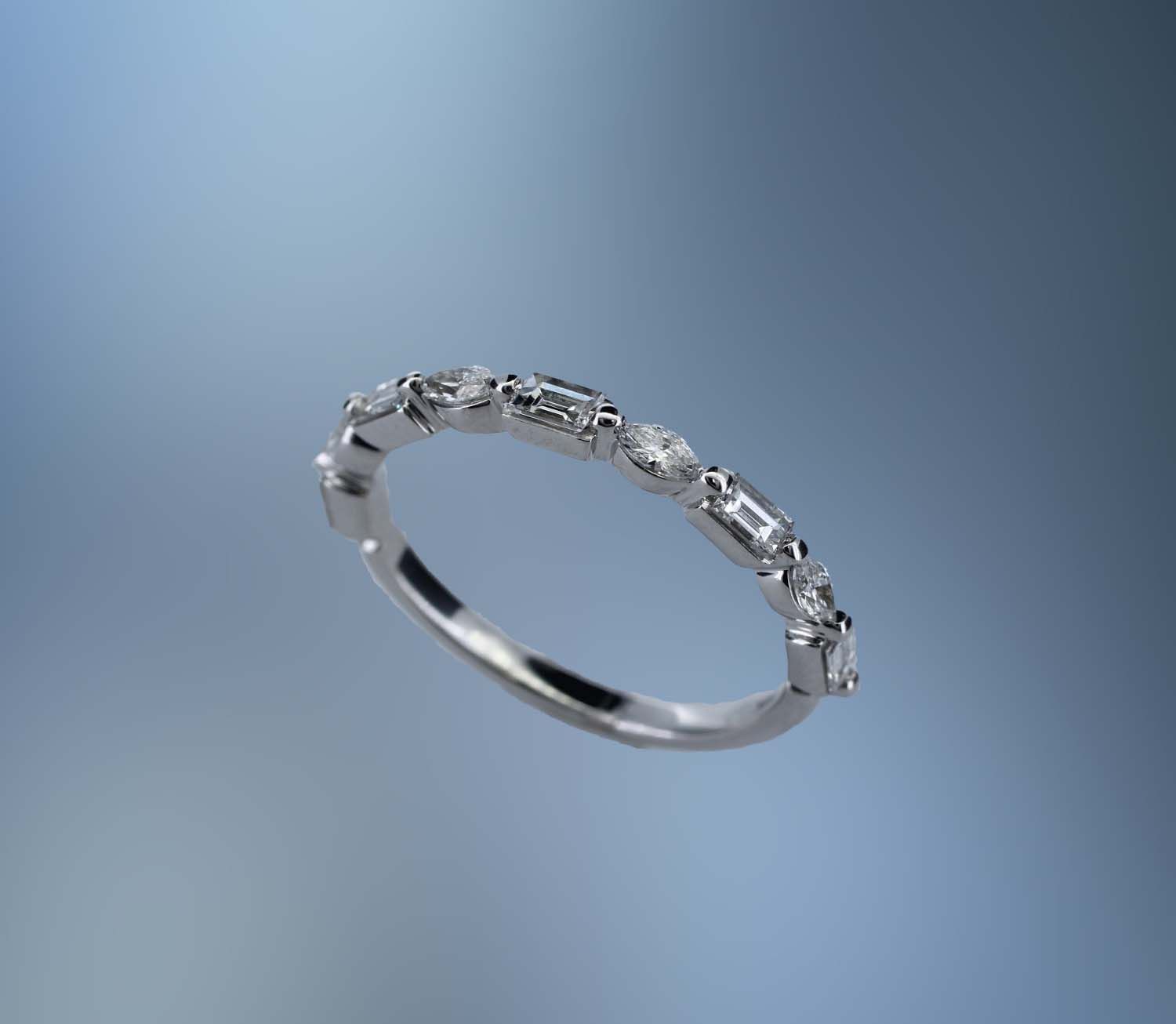 14KT WHITE GOLD LADY'S DIAMOND WEDDING BAND FEATURING 5 BAGUETTE CUT DIAMONDS AND 4 MARQUISE CUT DIAMONDS TOTALING 0.59 CTS 14KT WHITE GOLD LADY'S DIAMOND WEDDING BAND FEATURING 5 BAGUETTE CUT DIAMONDS AND 4 MARQUISE CUT DIAMONDS TOTALING 0.59 CTS