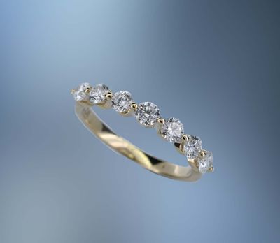 14KT YELLOW GOLD DIAMOND WEDDING BAND FEATURING 7 ROUND BRILLIANT DIAMONDS TOTALING 0.74 CTS 14KT YELLOW GOLD DIAMOND WEDDING BAND FEATURING 7 ROUND BRILLIANT DIAMONDS TOTALING 0.74 CTS