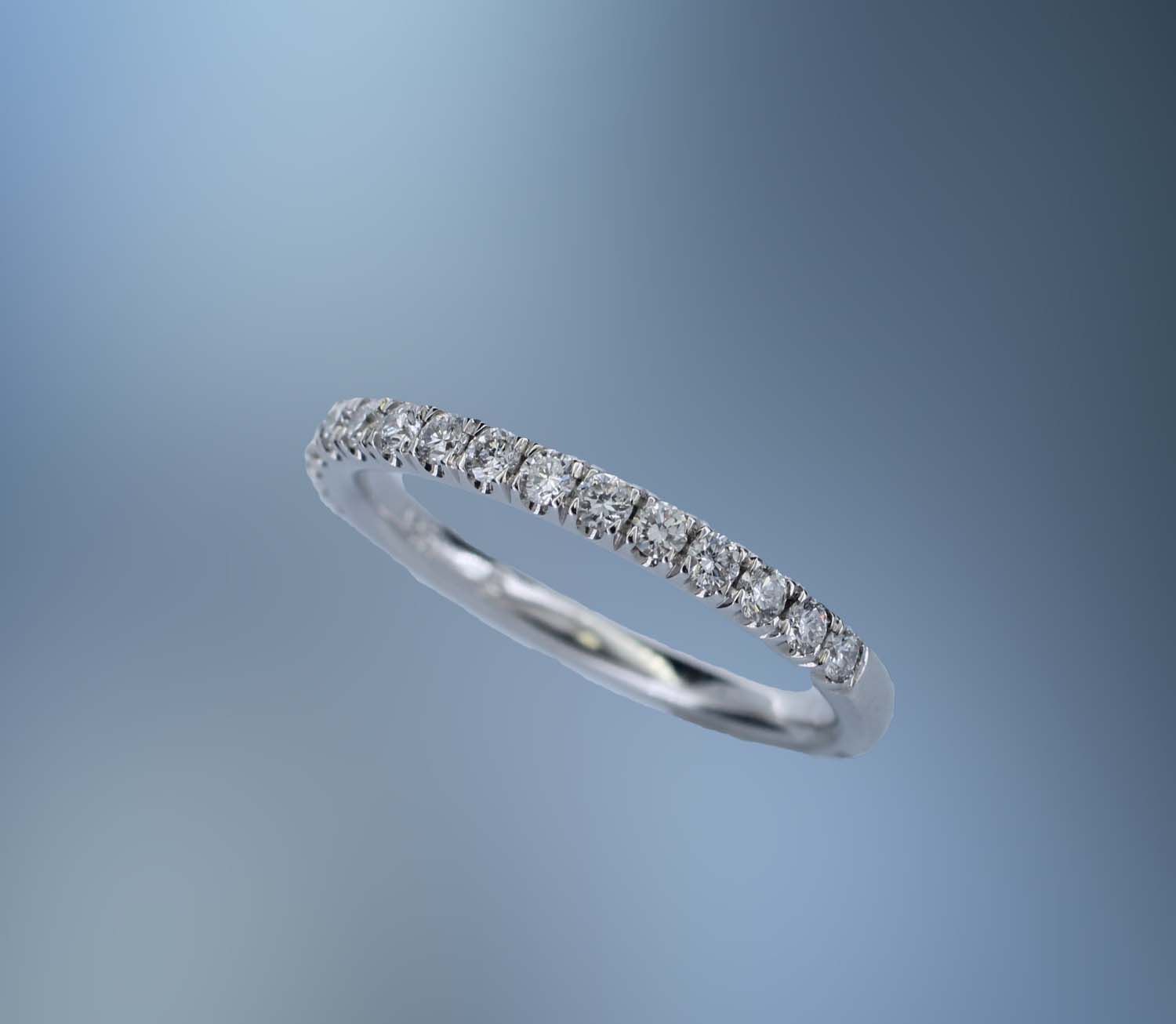14K WHITE GOLD PRONG SET DIAMOND WEDDING BAND FEATURING 16 ROUND BRILLIANT DIAMONDS TOTALING 0.35 CTS 14K WHITE GOLD PRONG SET DIAMOND WEDDING BAND FEATURING 16 ROUND BRILLIANT DIAMONDS TOTALING 0.35 CTS