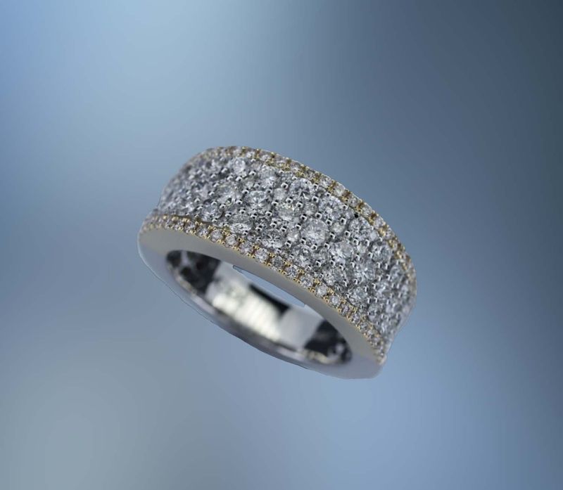 ONE 14KT WHITE AND YELLOW GOLD LADIES DIAMOND WEDDING BAND CONTAINING 133 NATURAL ROUND BRILLIANT CUT DIAMONDS TOTALING 1.67 CTS.​ ​