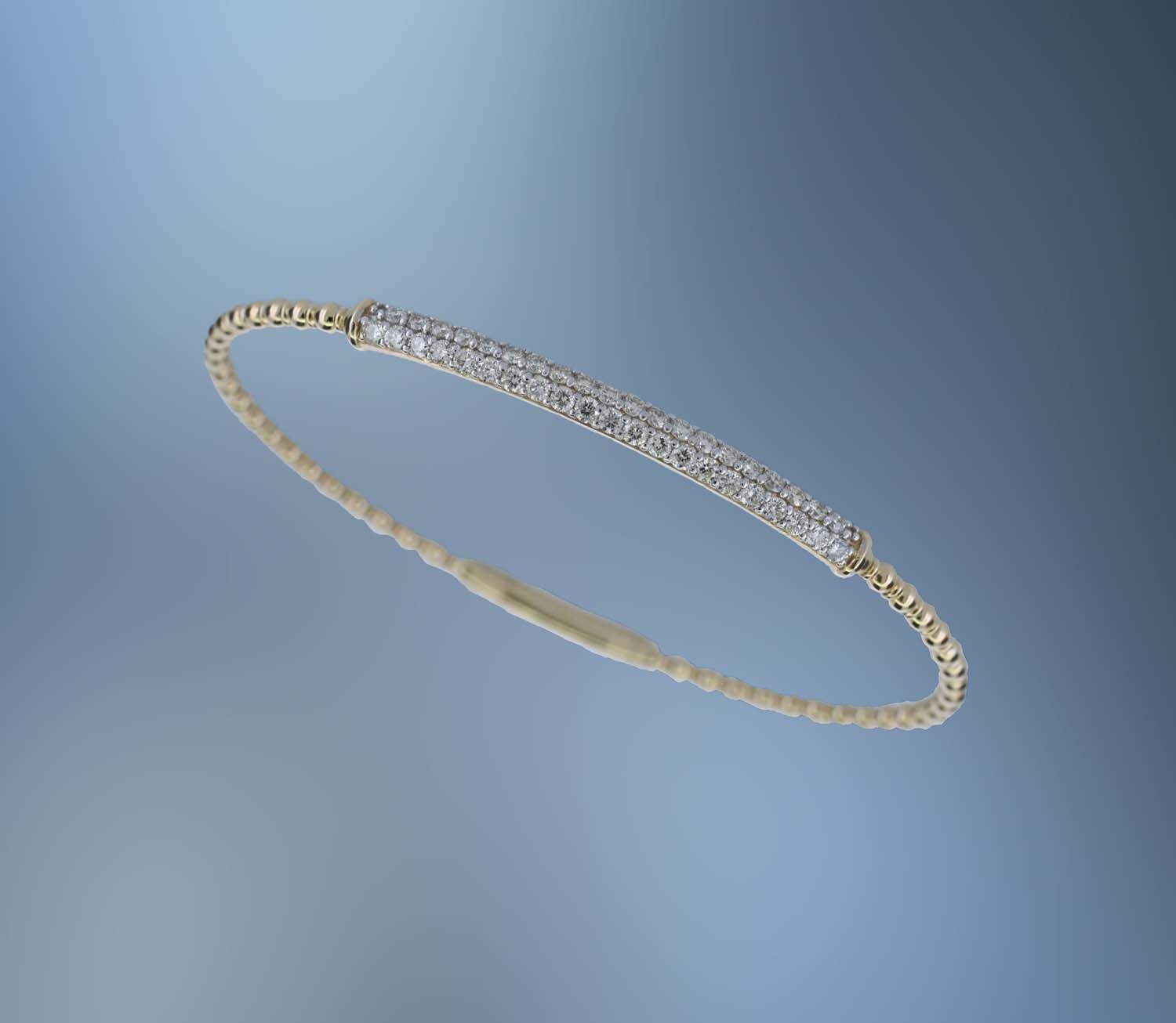 ONE 14KT YELLOW GOLD LADIES DIAMOND FLEXIBLE BRACELET CONTAINING .90 CTS. OF NATURAL ROUND BRILLIANT CUT DIAMONDS ONE 14KT YELLOW GOLD LADIES DIAMOND FLEXIBLE BRACELET CONTAINING .90 CTS. OF NATURAL ROUND BRILLIANT CUT DIAMONDS