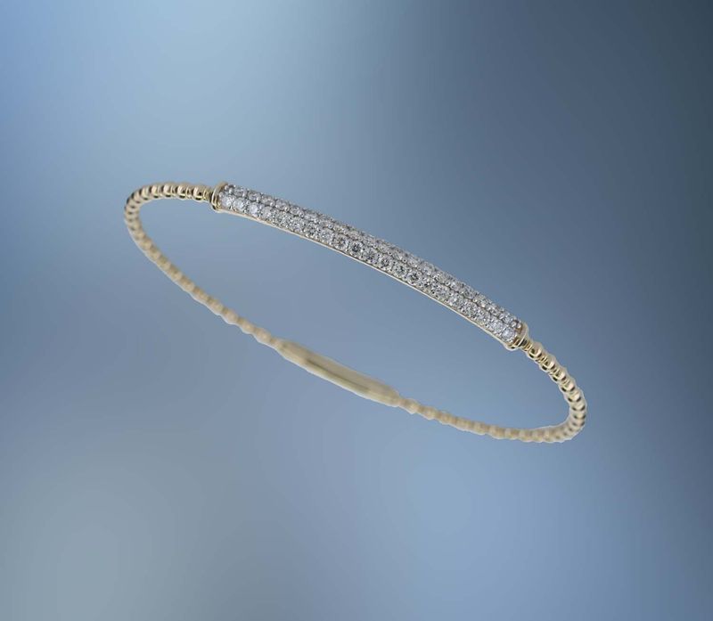 ONE 14KT YELLOW GOLD LADIES DIAMOND FLEXIBLE BRACELET CONTAINING .90 CTS. OF NATURAL ROUND BRILLIANT CUT DIAMONDS