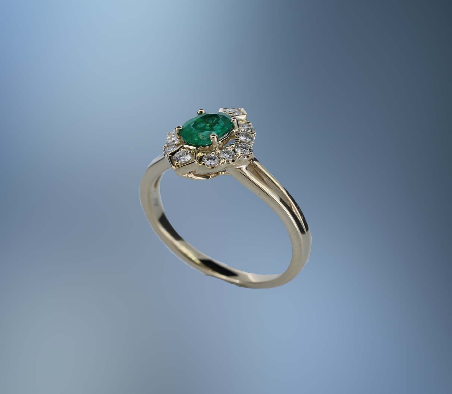 14 KARAT YELLOW GOLD EMERALD AND DIAMOND FASHION RING CONTAINING 1 OVAL SHAPE EMERALD WEIGHING 0.56 CARATS AND 12 ROUND BRILLIANT CUT DIAMONDS WEIGHING 0.24 CARATS 14 KARAT YELLOW GOLD EMERALD AND DIAMOND FASHION RING CONTAINING 1 OVAL SHAPE EMERALD WEIGHING 0.56 CARATS AND 12 ROUND BRILLIANT CUT DIAMONDS WEIGHING 0.24 CARATS