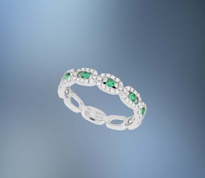 14KT WHITE GOLD DIAMOND & EMERALD BAND FEATURING 5 EMERALDS & 60 ROUND BRILLIANT DIAMONDS TOTALING .32 CTS 14KT WHITE GOLD DIAMOND & EMERALD BAND FEATURING 5 EMERALDS & 60 ROUND BRILLIANT DIAMONDS TOTALING .32 CTS