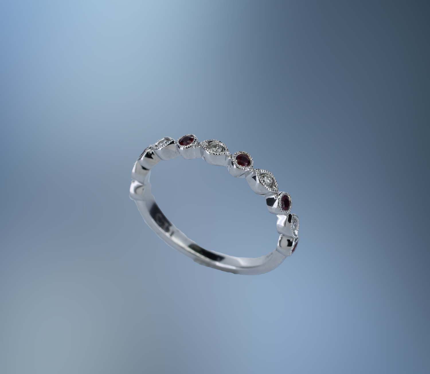 14KT WHITE GOLD DIAMOND & RUBY BAND CONTAINING 5 ROUND BRILLIANT DIAMONDS TOTALING .08 CTS & 6 ROUND RUBIES TOTALING .17 CTS​ ​