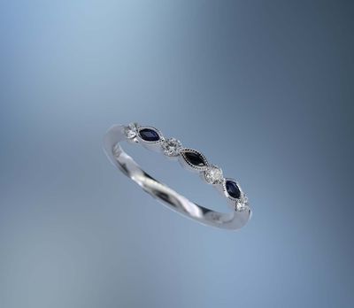 14KT WHITE GOLD DIAMOND & SAPPHIRE BAND CONTAINING 4 ROUND BRILLIANT DIAMONDS TOTALING .19 CTS & 3 MARQ SAPHIRES TOTALING .14 CTS 14KT WHITE GOLD DIAMOND & SAPPHIRE BAND CONTAINING 4 ROUND BRILLIANT DIAMONDS TOTALING .19 CTS & 3 MARQ SAPHIRES TOTALING .14 CTS