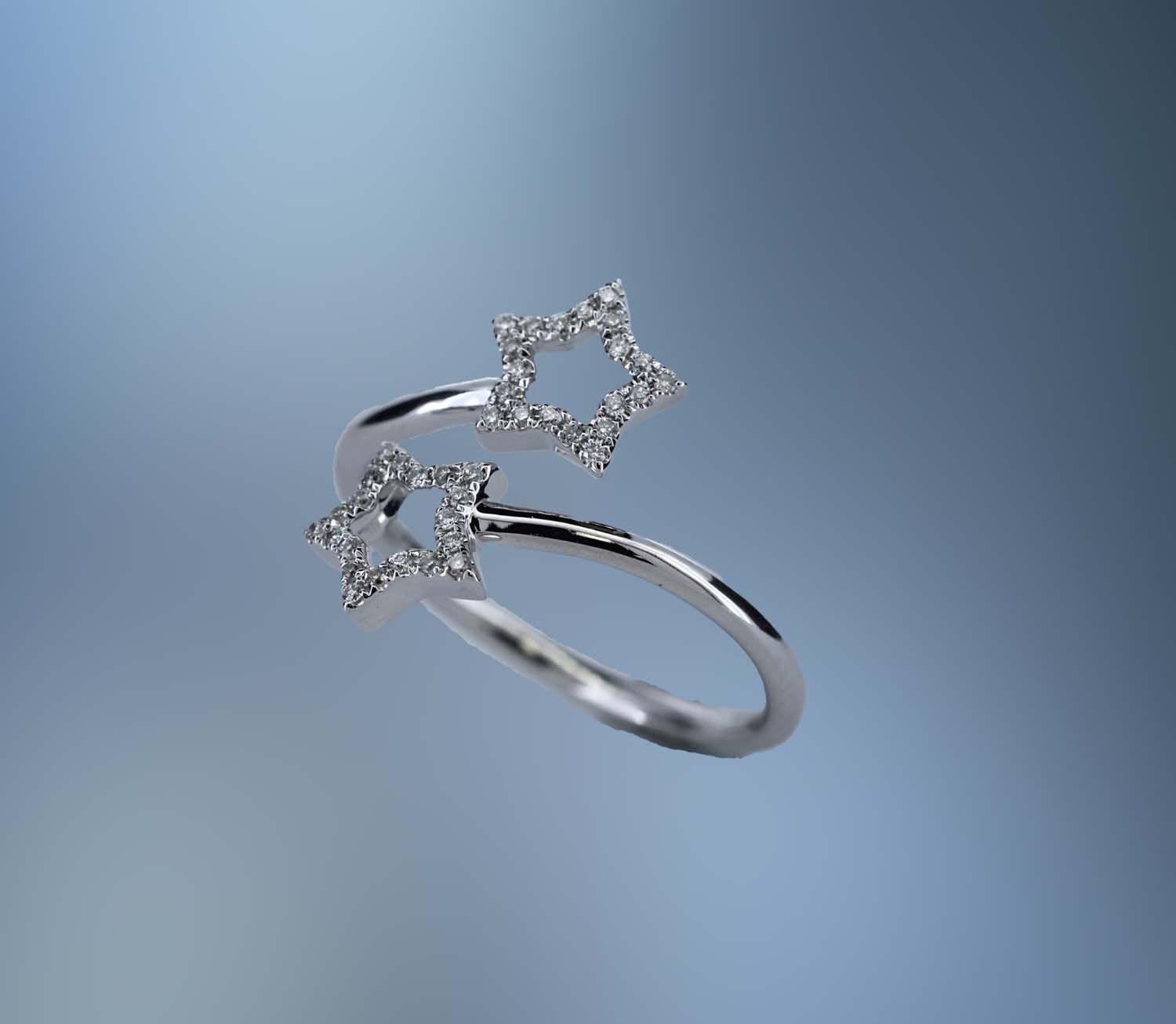 14KT WHITE GOLD DIAMOND STAR BYPASS RING FEATURING 40 ROUND BRILLIANT CUT DIAMONDS TOTALING .12 CTS 14KT WHITE GOLD DIAMOND STAR BYPASS RING FEATURING 40 ROUND BRILLIANT CUT DIAMONDS TOTALING .12 CTS