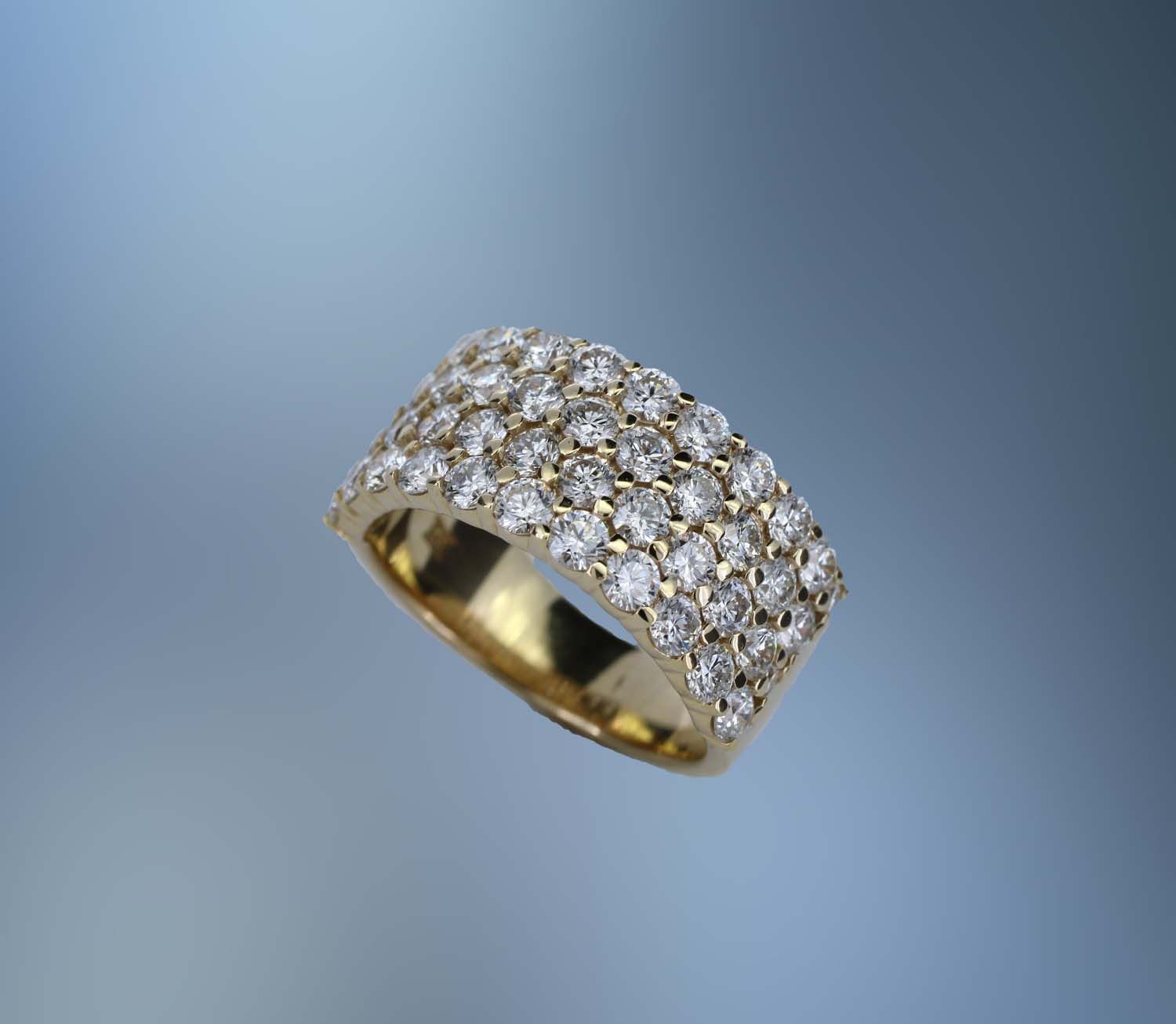 14 KT YELLOW GOLD DIAMOND BAND FEATURING 46 ROUND BRILLIANT CUT TOTALING 2.59 CTS