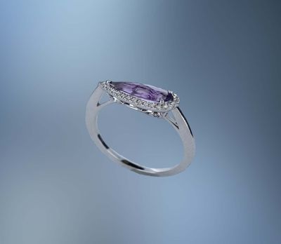 14KT WHITE GOLD RING FEATURING 1 FANTASY CUT AMETHYST TOTALING 1.10 CTS AND 29 ROUND BRILLIANT CUT DIAMONDS TOTALING .08 CTS
