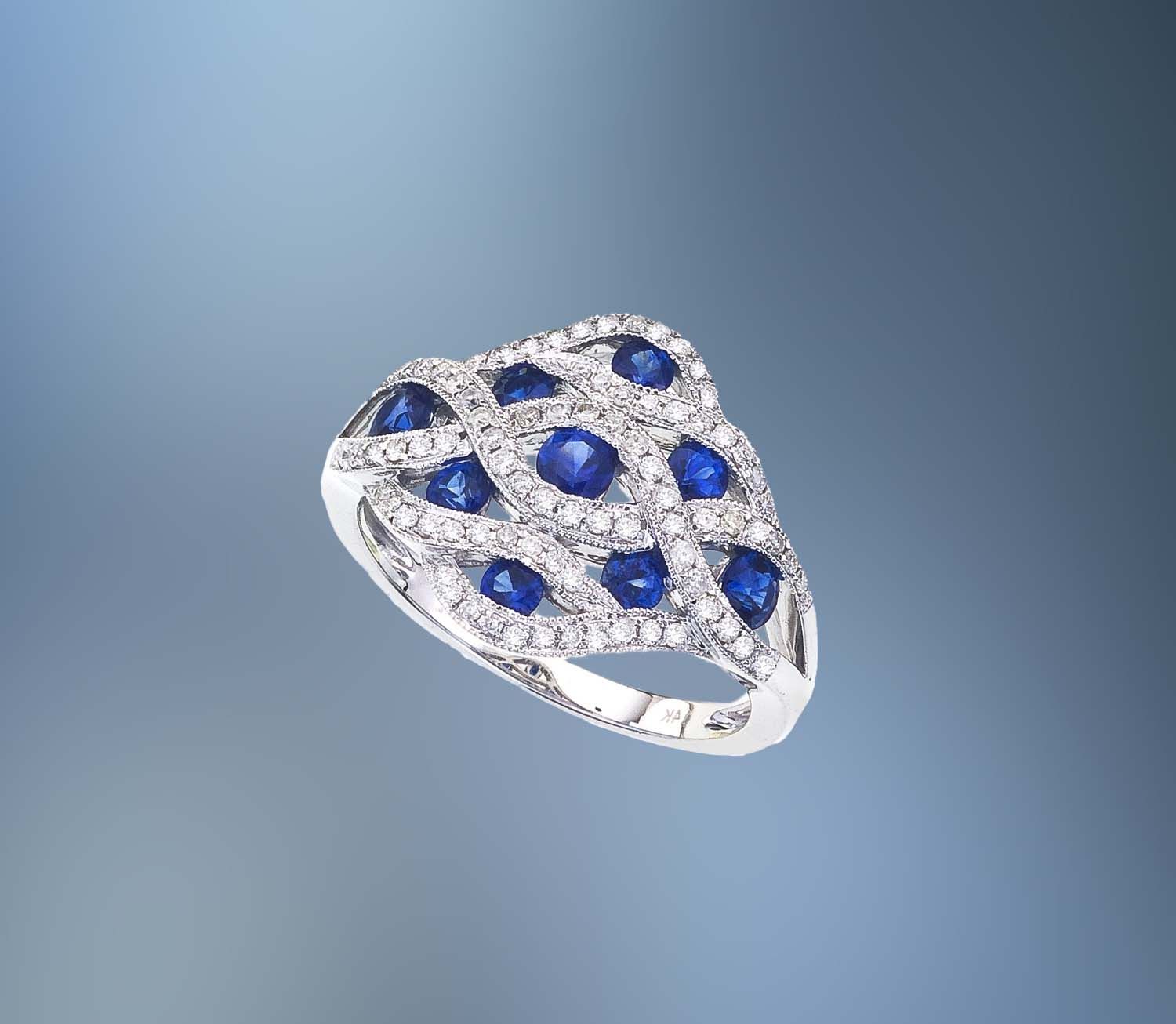 14KT WHITE GOLD SAPPHIRE AND DIAMOND FASHION RING FEATURING 9 SAPPHIRES TOTALING .93 CTS AND 82 ROUND BRILLIANT CUT DIAMONDS  TOTALING .28 CTS