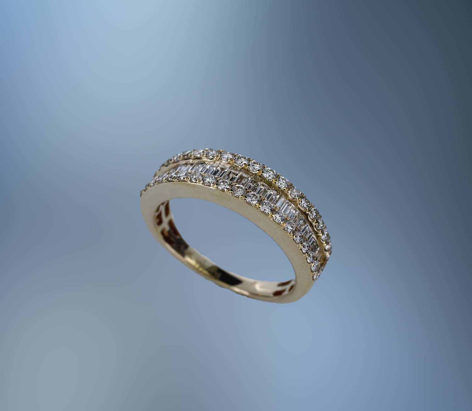 14KT YELLOW GOLD DIAMOND WEDDING BAND FEATURING 38  ROUND  BRILLIANT CUT DIAMONDS AND 24 BAGUETTES, TOTALING .95 CTS.