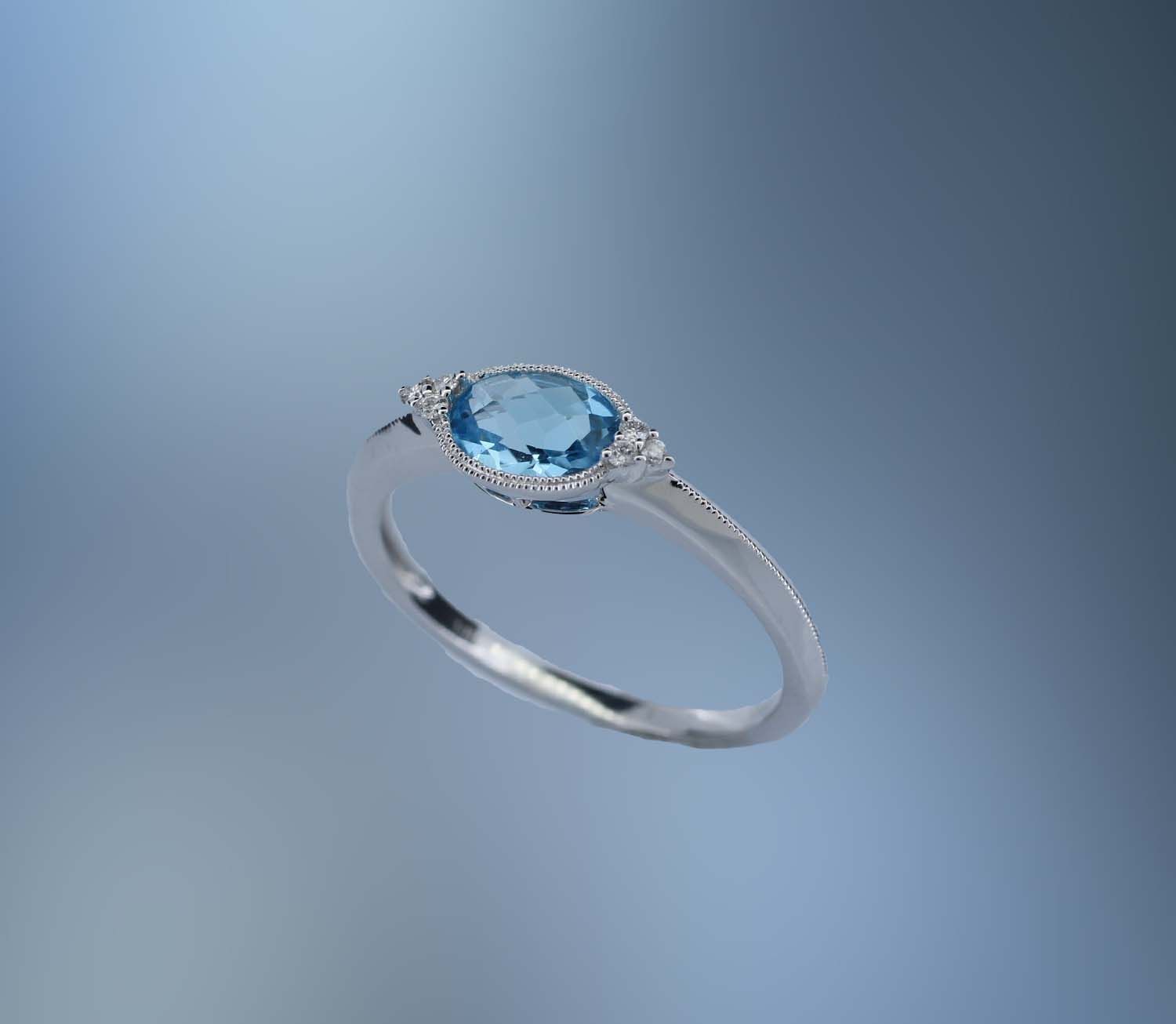 ONE 14KT WHITE GOLD LADIES BLUE TOPAZ AND DIAMOND RING ONE 14KT WHITE GOLD LADIES BLUE TOPAZ AND DIAMOND RING