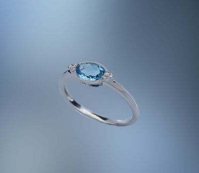 ONE 14KT WHITE GOLD LADIES BLUE TOPAZ AND DIAMOND RING ONE 14KT WHITE GOLD LADIES BLUE TOPAZ AND DIAMOND RING