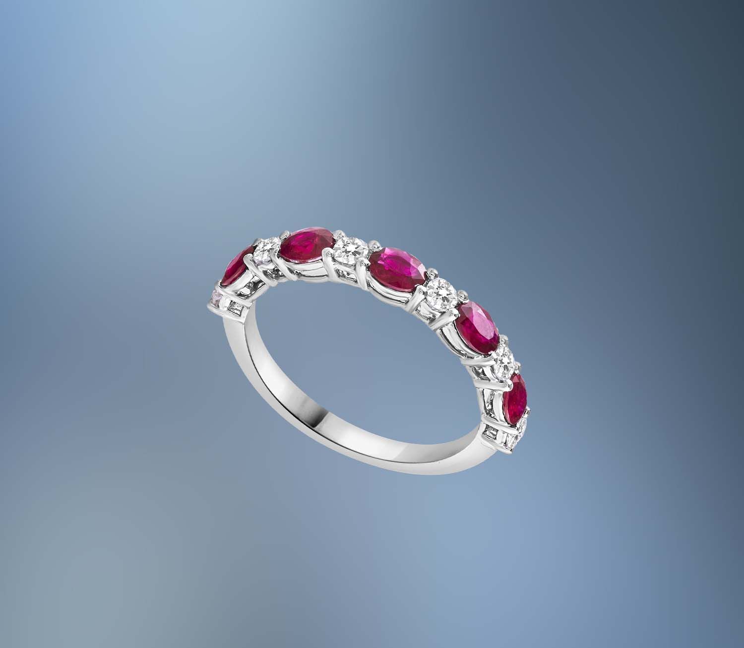 ONE 14KT WHITE GOLD LADIES DIAMOND AND RUBY RING CONTAINING .81 CTS OF OVAL FACETED CUT NATURAL RUBIES AND .29 CTS OF NATURAL ROUND BRILLIANT CUT DIAMONDS ONE 14KT WHITE GOLD LADIES DIAMOND AND RUBY RING CONTAINING .81 CTS OF OVAL FACETED CUT NATURAL RUBIES AND .29 CTS OF NATURAL ROUND BRILLIANT CUT DIAMONDS