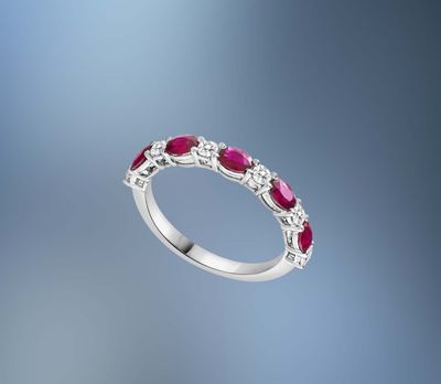 ONE 14KT WHITE GOLD LADIES DIAMOND AND RUBY RING CONTAINING .81 CTS OF OVAL FACETED CUT NATURAL RUBIES AND .29 CTS OF NATURAL ROUND BRILLIANT CUT DIAMONDS