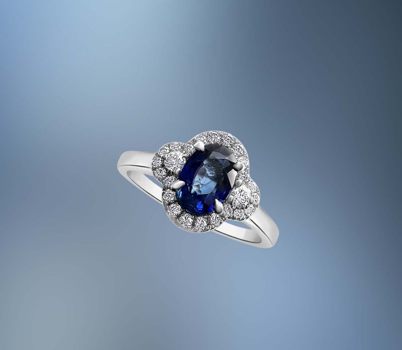 ONE 14KT WHITE GOLD LADIES DIAMOND AND SAPPHIRE RING