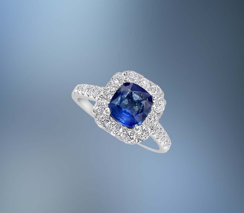 ONE 14KT WHITE GOLD LADIES DIAMOND AND BLUE SAPPHIRE RING